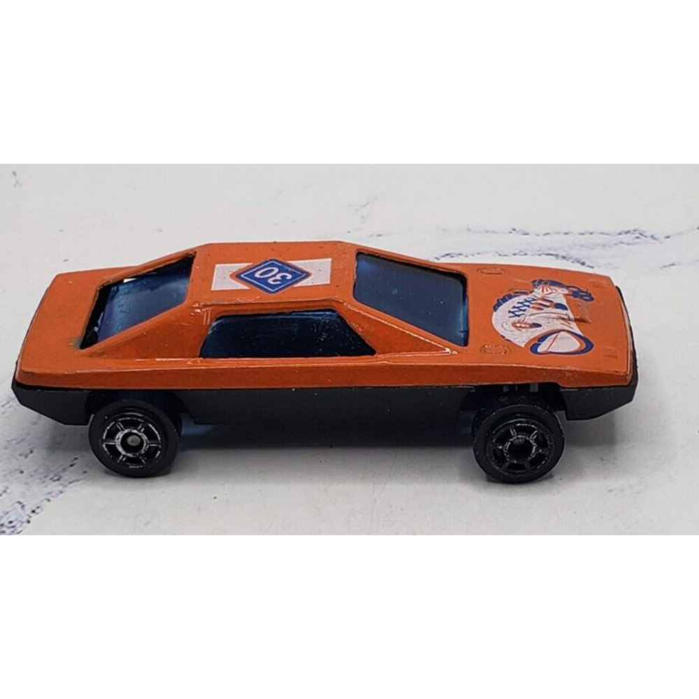 Diecast Orange Sports Car With Fish Theme on Hood